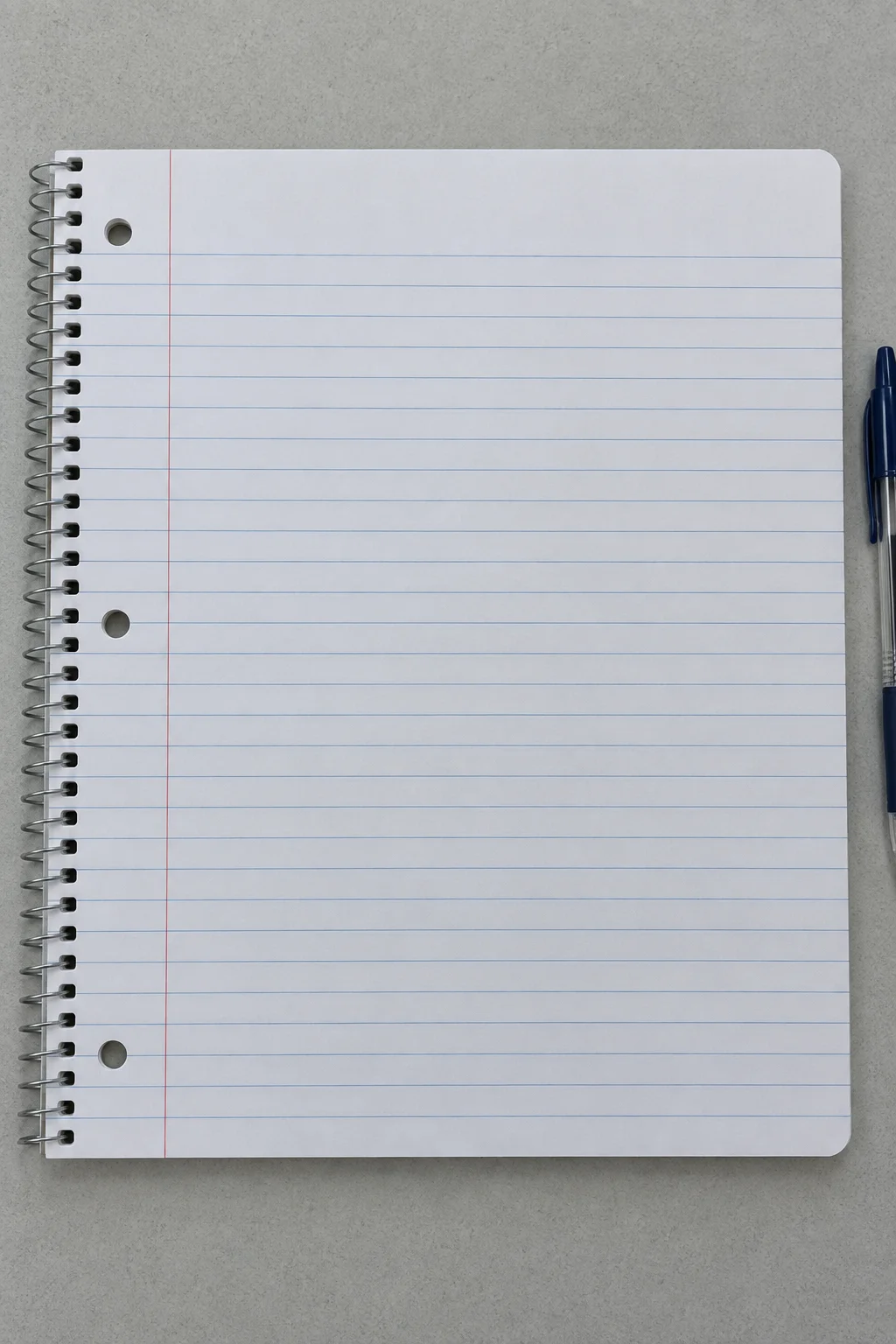 Wide ruled spiral notebook paper with a red margin